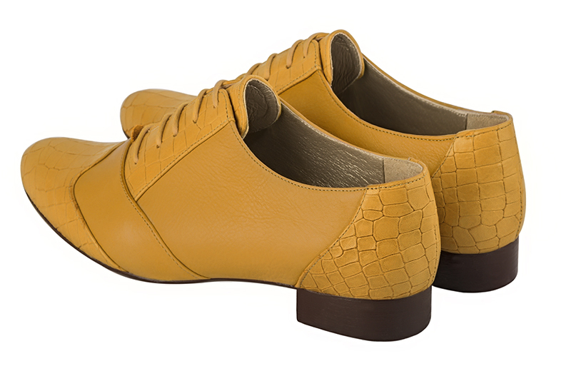 Mustard yellow women's fashion lace-up shoes. Round toe. Flat leather soles. Rear view - Florence KOOIJMAN